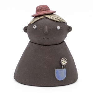 Back (sad) view of two-faced stoneware container