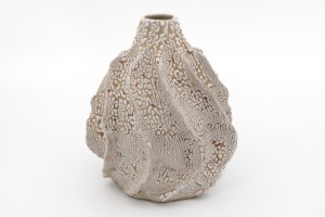 Coiled and pinched bottle with white crawl glaze